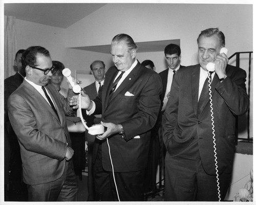 Unidentified Males Shown Conversing on Telephones