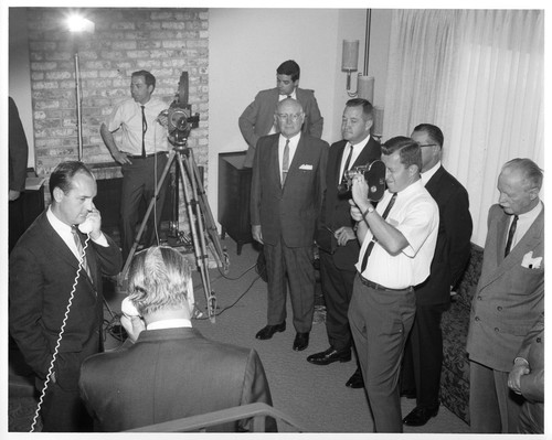 Mayor Ron James On the Telephone Surrounded by Onlookers