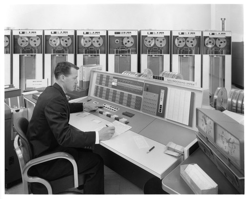 Unknown Male Analyzing Data Sets on an IBM 7090 Data Processing System