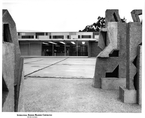 Partial View of IBM Building 25 Flanked by Stone Sculptures