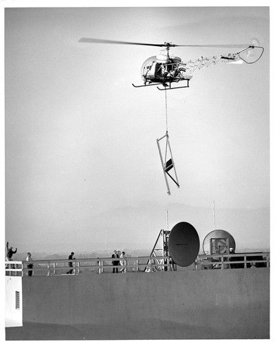 Image of Helicopter Hovering Over San Jose Rooftop