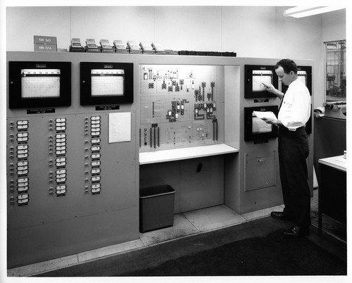 Engineer Checking Readings of Various Ovens at the Fremont GMC Assembly Plant