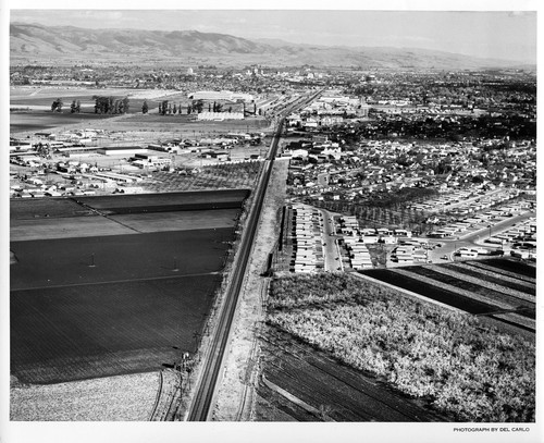 Southeast Aerial View Along Rail Road Tracks Into San Jose, CA