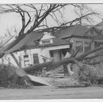 View of the storm damage that toppled nearly 1,000 trees in the "Windstorm of 1938". This image is on the southwest corner of 17th and M Streets