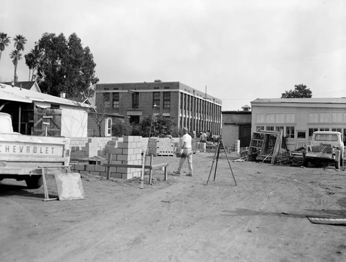 Masons setting concrete blocks for a new garage at Hale Observatories, Santa Barbara Street, Pasadena