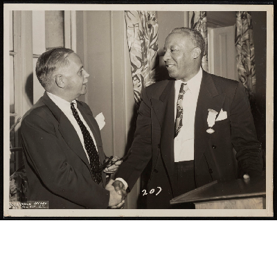 A. Philip Randolph shaking hands with Walter White