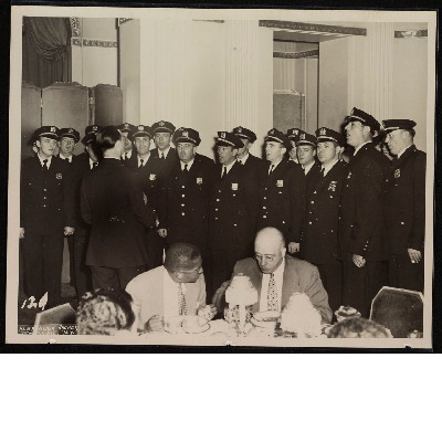 Policemen choir singing at dinner banquet