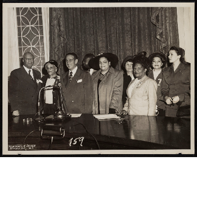 A. Philip Randolph, Lucille Campbell Green, Vincent Impellitteri, with four unidentified women