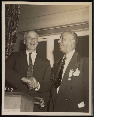 A. Philip Randolph shaking hands with Norman Thomas