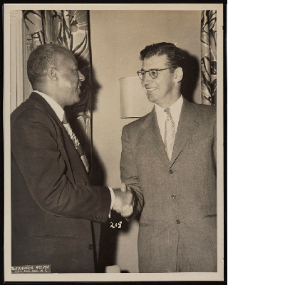 A. Philip Randolph shaking hands with Joseph L. Rauh Jr