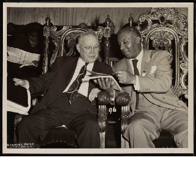 William Green and A. Philip Randolph talking