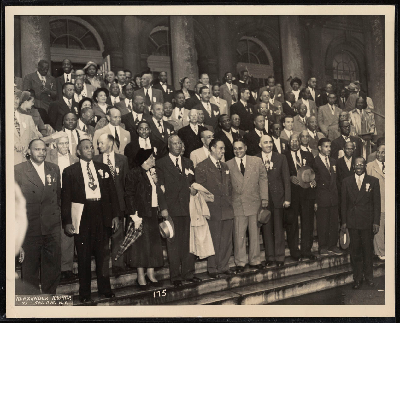 Group photograph on the steps of city hall following a reception for A. Philip Randolph by the mayor's committee