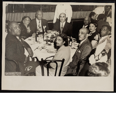 Dinner banquet (left-right): M.P. Webster, Lucille Campbell Green, A. Philip Randolph, C.L. Dellums, unidentified, Mrs. Smith, Mrs. Bennie Smith, Bennie Smith, E.J. Bradley, Mrs. Bradley