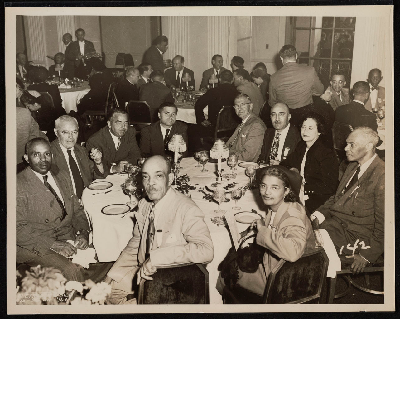 Dinner banquet (left-right): James Johnson, unidentified person, C.L. Dellums, Thomas T. Patterson, Mrs. E.J. Bradley, E.J. Bradley