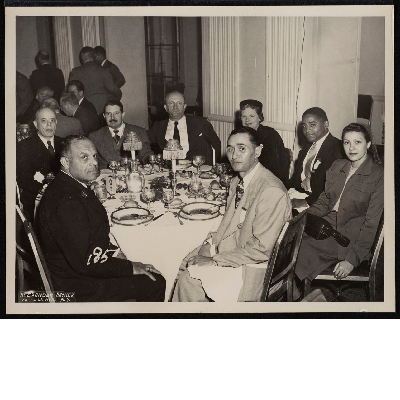 Dinner banquet (left-right): Wesley Williams, unidentified, Richard Bourne-Vonneck, unidentified, unidentified, Theodore E. Brown, Mrs. McNeal, T.D. McNeal