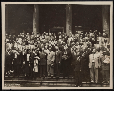 Group photograph on the steps of city hall following a reception for A. Philip Randolph by the mayor's committee