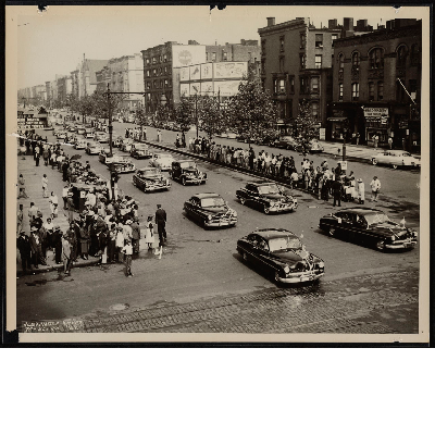 Cars in parade at West 125th Street in New York City, New York