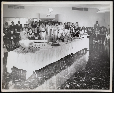Group standing around buffet table