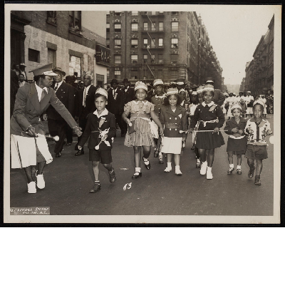 Children in the Junior Herd Dancing Club marching in parade