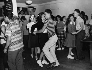 Members of the Boy's Club Canteen and their guests enjoy dancing, 1945