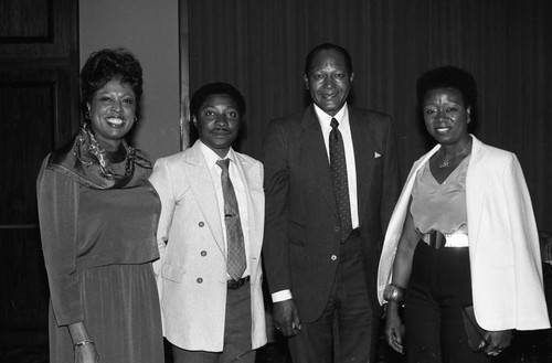 Diane Watson and Tom Bradley posing with others at the Bohana 50th wedding anniversary, Los Angeles, 1984