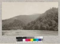 The French Broad river from the highway near Hot Springs, N. C. This river is one of the famous streams of the region and the highway to Knoxville, Tenn. crosses it several times. Where the forest is given a chance the hardwoods make splendid growth