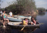 Students sitting on boats