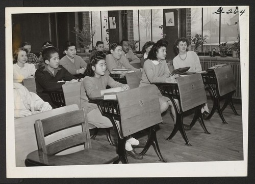 Nisei boys and girls in Chicago find a ready welcome in the Midwest schools. Here is an assembly class in