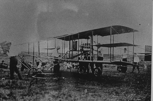 Mechanics working on Curtiss biplane