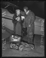 Frank Kurtz, aviator, and Betty Driscoll, USC student, next to his plane "Yankee Boy," Los Angeles, 1935