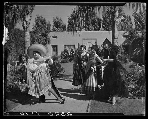 Women in Spanish-style dress, 2 dancing, Harry Gorham residence, Santa Monica, 1928