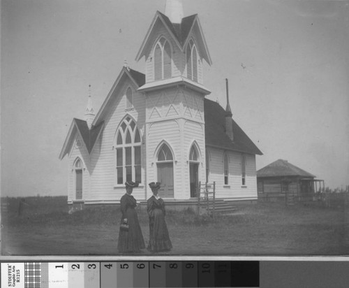 Abigail Fulkerth and an unidentified woman stand before Turlock's first church, circa 1889