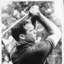 Bob Lunn, pro golfer, swinging a club