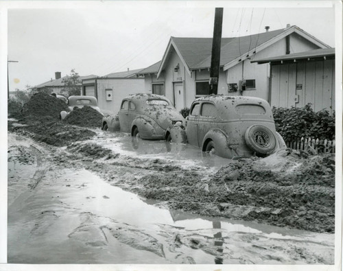 Cars stuck in mud deposit after fierce Topanga storm, 1941