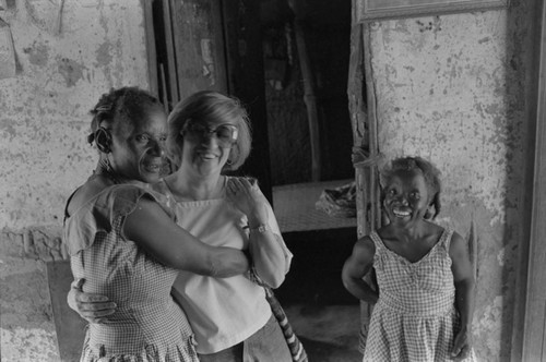 Nina S. de Friedemann hugging a woman,, San Basilio del Palenque, ca. 1978