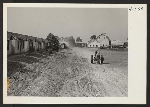 Showing some of the dormitories and the mess hall which were built by the Hellwig Brothers on their farm west
