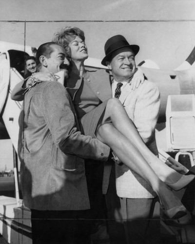 Jerry Colonna, Janis Paige and Bob Hope departing for annual holiday tour