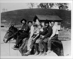 Seven boys on a horse at the Lytton Home (the Salvation Army Boys and Girls Industrial Home and Farm in Lytton, California), Lytton, California, 1921