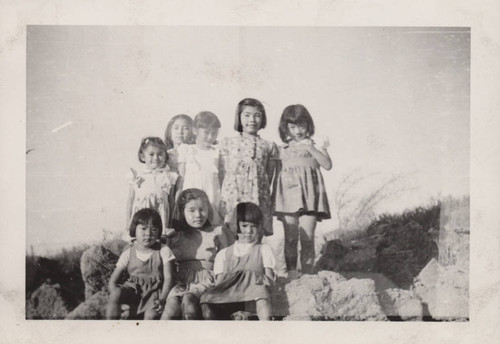 Little girls on rocks at Poston incarceration camp
