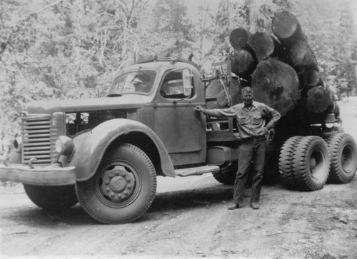 Bob Lowery and in logging truck
