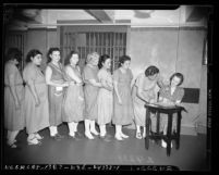 Women prison inmates registering to vote in Los Angeles, Calif., 1940