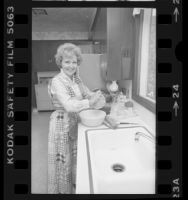 Actress Betty White preparing meal in Los Angeles, Calif., 1976