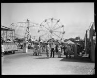 Amusement rides and the crowd at the Los Angeles County Fair, Pomona, 1932