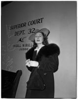 Mrs. Ella Peskay standing in a courtroom, Los Angeles