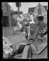 Sergei Gerasimov and Playwright Georgrii Mdivani tour Disneyland in fire engine, Anaheim, 1958