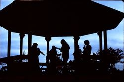 Gazebo at Brookhaven Park in Sebastopol with a group of musicians playing, 1976