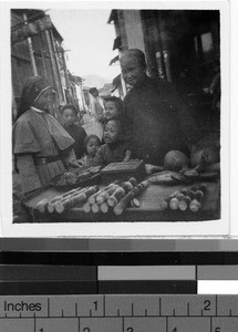 Native Sister woman at market, Kaying, China, ca. 1940