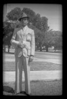 H. H. West Jr. stands on the West's front lawn, Los Angeles, 1937