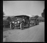 H. H. West and company's cars parked along the road for a rest stop, Mendocino County vicinity, 1915