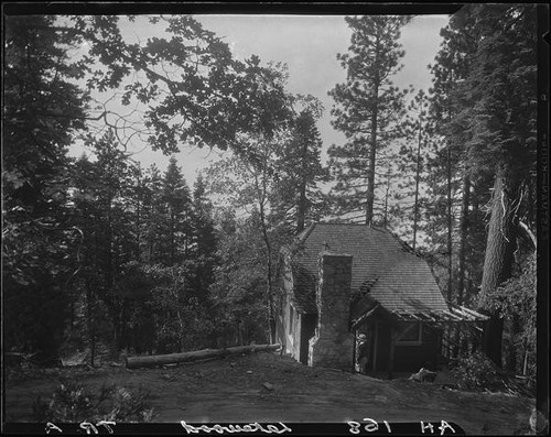 House with shake roof, stone chimney, and open-roofed porch, Lake Arrowhead, 1929